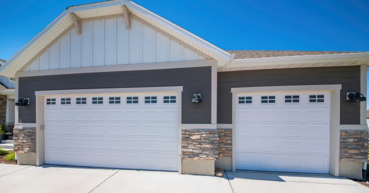 Modern home with two white garage doors
